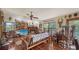 Bright living room boasting wood floors, a fireplace, and many windows at 2230 Myakka Rd, Sarasota, FL 34240