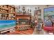 The living room has a cozy fireplace with decorative wooden art pieces at 2230 Myakka Rd, Sarasota, FL 34240