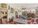 Open-concept living room featuring fireplace, wooden floors, and unique decor at 2230 Myakka Rd, Sarasota, FL 34240