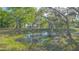 Scenic view of a lush pond surrounded by trees draped with Spanish moss at 2230 Myakka Rd, Sarasota, FL 34240