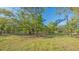 Expansive green property with mature trees and a peaceful, park-like setting at 2230 Myakka Rd, Sarasota, FL 34240