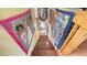 Wooden stairway with unique artwork displayed on the walls at 2230 Myakka Rd, Sarasota, FL 34240