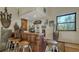 Rustic wet bar with wood countertop and adjacent seating, ideal for entertaining at 2230 Myakka Rd, Sarasota, FL 34240