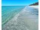 Beautiful beach showing clear blue water lapping on the sandy shore at 22337 Olean Blvd, Port Charlotte, FL 33952