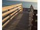 A wooden boardwalk provides a walk to the beach and ocean views at 22337 Olean Blvd, Port Charlotte, FL 33952