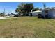 Street view of the home with a lush lawn at 22337 Olean Blvd, Port Charlotte, FL 33952