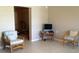 Cozy living room featuring tile floors and comfortable wicker furniture, perfect for relaxation at 22337 Olean Blvd, Port Charlotte, FL 33952