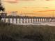Pier at sunset, with people enjoying the view and beautiful sky at 22337 Olean Blvd, Port Charlotte, FL 33952