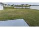 Expansive backyard featuring a tranquil pond view and fenced perimeter for privacy at 2409 Sand Gables Trl, Bradenton, FL 34208