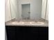 Bathroom featuring double sinks and vanity, creating a well-equipped space at 2409 Sand Gables Trl, Bradenton, FL 34208