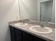 Bathroom featuring a double vanity, laminate countertop and undermount sinks with bright chrome faucets at 2409 Sand Gables Trl, Bradenton, FL 34208