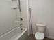 Bright bathroom featuring a tub/shower, toilet, and fixtures, all designed for comfort at 2409 Sand Gables Trl, Bradenton, FL 34208