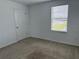 Bedroom filled with natural light from the window and featuring a white door at 2409 Sand Gables Trl, Bradenton, FL 34208