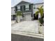 Charming townhome featuring a two-car garage, manicured landscaping, and neutral color scheme at 2846 Midnight Pearl Dr, Sarasota, FL 34240