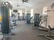 Bright gym, equipped with treadmills and weight machines, offers a complete fitness experience at 2846 Midnight Pearl Dr, Sarasota, FL 34240
