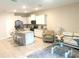 Open concept design showing the living room and kitchen, featuring modern decor and natural light at 2846 Midnight Pearl Dr, Sarasota, FL 34240