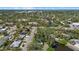 Aerial view of a residential area with a waterway meandering through the landscape at 3466 Tanglewood Dr, Sarasota, FL 34239