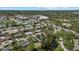 Scenic aerial view of a neighborhood with tree-lined streets and lush landscapes at 3466 Tanglewood Dr, Sarasota, FL 34239