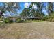 Backyard with lush greenery, providing a private and serene outdoor space at 3466 Tanglewood Dr, Sarasota, FL 34239