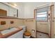 Classic bathroom featuring a shower stall, sink, and toilet with retro finishes at 3466 Tanglewood Dr, Sarasota, FL 34239