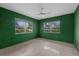 Bedroom features two windows and a ceiling fan at 3466 Tanglewood Dr, Sarasota, FL 34239