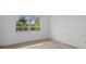 Bright bedroom featuring a window with a view of lush greenery at 3466 Tanglewood Dr, Sarasota, FL 34239