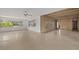 Bright living room with large windows, tile floors, and exposed beam ceiling at 3466 Tanglewood Dr, Sarasota, FL 34239