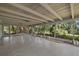 Enclosed patio featuring a concrete floor and views of the surrounding landscaping at 3466 Tanglewood Dr, Sarasota, FL 34239