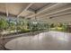 Enclosed patio featuring a concrete floor and views of the surrounding landscaping at 3466 Tanglewood Dr, Sarasota, FL 34239