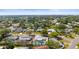 The aerial shot captures the home, pool, and well-manicured lawn in a tranquil neighborhood setting at 3502 18Th Avenue W Dr, Bradenton, FL 34205