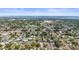 An aerial view of the neighborhood showcases homes with pools and mature landscaping near a bay at 3502 18Th Avenue W Dr, Bradenton, FL 34205