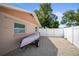 The backyard features gravel ground cover and a white fence, offering privacy and boat storage at 3502 18Th Avenue W Dr, Bradenton, FL 34205