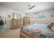 Bedroom with tiled floor, a large mirror and a window view of the outside at 3502 18Th Avenue W Dr, Bradenton, FL 34205