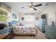Bright bedroom with beach-themed decor, blue accents, and a ceiling fan for added comfort at 3502 18Th Avenue W Dr, Bradenton, FL 34205