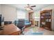 Bright bedroom with a daybed, built-in bookshelves, and neutral walls at 3502 18Th Avenue W Dr, Bradenton, FL 34205