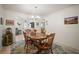 Inviting dining room with wood table, chandelier, and access to other living spaces at 3502 18Th Avenue W Dr, Bradenton, FL 34205