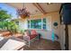 Inviting front porch with colorful flowers, comfortable seating, and decorative accents at 3502 18Th Avenue W Dr, Bradenton, FL 34205