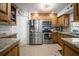 Well-equipped kitchen featuring stainless steel appliances, granite countertops, and ample cabinet space at 3502 18Th Avenue W Dr, Bradenton, FL 34205
