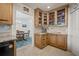 The kitchen features wooden cabinets, granite countertops, and an adjacent dining area at 3502 18Th Avenue W Dr, Bradenton, FL 34205