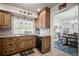 This renovated kitchen with wooden cabinets connects to the dining and living areas at 3502 18Th Avenue W Dr, Bradenton, FL 34205