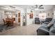 Open living space featuring tile flooring, a ceiling fan, and views into the dining and kitchen areas at 3502 18Th Avenue W Dr, Bradenton, FL 34205