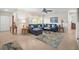 Spacious living room with a plush sectional sofa, warm lighting, and an open layout at 3502 18Th Avenue W Dr, Bradenton, FL 34205