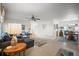 Open-concept living room with a comfortable blue sofa and seamless flow into the dining area at 3502 18Th Avenue W Dr, Bradenton, FL 34205