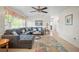 Cozy living room featuring a large sectional sofa and a decorative area rug at 3502 18Th Avenue W Dr, Bradenton, FL 34205