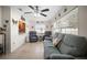 Cozy living room with tile floors, ceiling fan, and comfortable seating arrangement at 3502 18Th Avenue W Dr, Bradenton, FL 34205