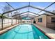 Pool area featuring a large pool, shaded seating and a grill at 3502 18Th Avenue W Dr, Bradenton, FL 34205