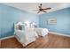This cute bedroom features two twin beds, hardwood floors and ample light at 3551 Ridgeland Ct, Punta Gorda, FL 33982