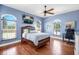 Large bedroom with hardwood floors, ceiling fan and lots of natural light at 3551 Ridgeland Ct, Punta Gorda, FL 33982