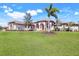 Beautiful single-story home with a well-manicured lawn and tasteful landscaping at 3551 Ridgeland Ct, Punta Gorda, FL 33982
