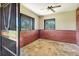 Clean and sturdy horse stall with secure metal bars and wood paneling at 3551 Ridgeland Ct, Punta Gorda, FL 33982